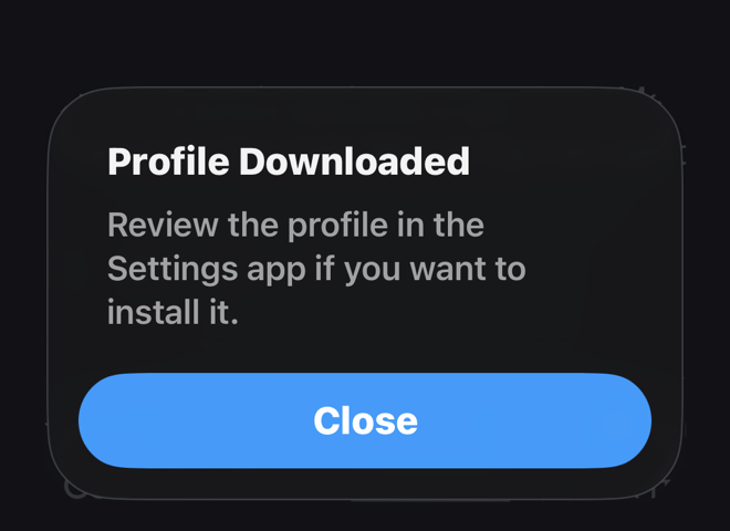 iOS dialog: Profile Downloaded — review the profile in the Settings app if you want to install it.